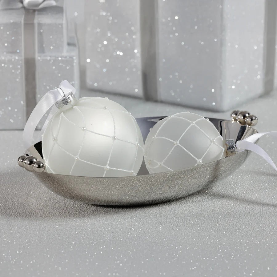 The ZODAX POLISHED NICKEL SERVING BOWL is a shiny, oval-shaped silver decorative bowl featuring two polished nickel round handles on opposite sides, displayed against a white background.