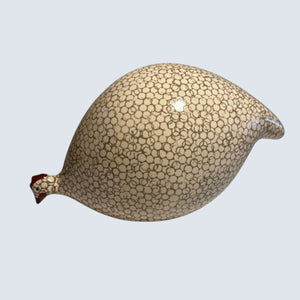 The LES CERAMIQUES DE LUSSAN - Pecking Ceramic French Guinea in White Spotted Gray is a ceramic figurine inspired by traditional French pottery, featuring a beige base adorned with a pattern of small dark circles and a red comb accent, displayed on a white background.
