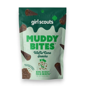 Image of a MUDDY BITES- THIN MINT WAFFLE CONES product package. The green package emphasizes the Girl Scout Thin Mints flavor, featuring mini waffle cones filled with mint chocolate and dark chocolate. It also showcases nutrition facts, GMO-Free and Kosher certifications, and resealable packaging for freshness. Founders: Jared and Tyler.