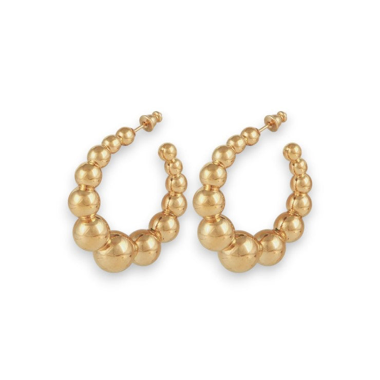 The GAS BIJOUX - ANDY CREOLE EARRING features gold plated hoops embellished with graduated spherical beads for a sophisticated, textured appearance. The hoops boast a shiny finish and are symmetrically arranged to elevate their chic design, all set against a plain white background.