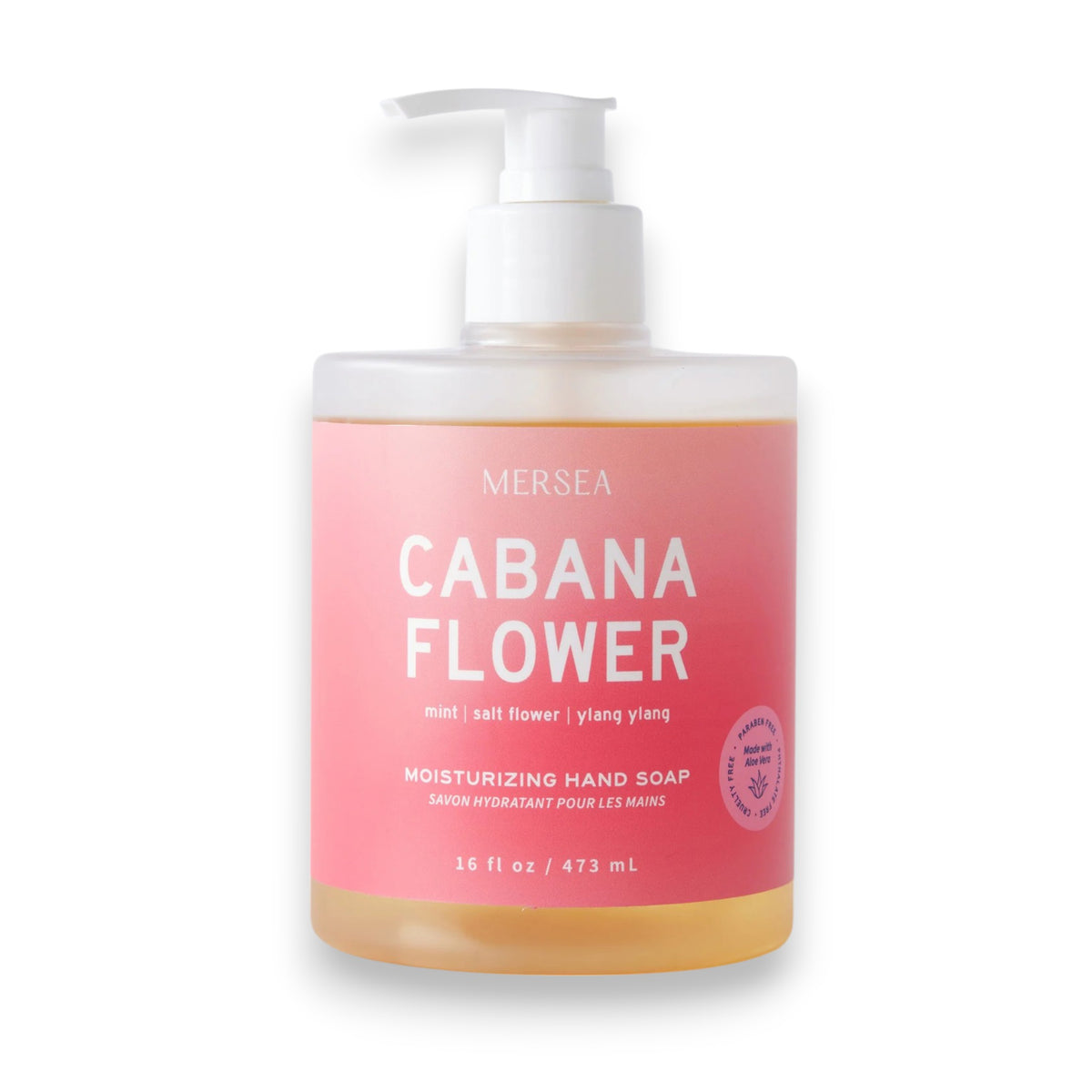 A clear pump bottle of MERSEA - CABANA FLOWER HAND SOAP 16OZ features a pink label with white text and a small seal, highlighting refreshing Mint, Salt Flower, and Ylang Ylang scents from the brand MERSEA.