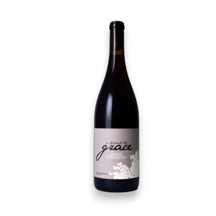 A bottle of WINE: KELLOGG SELECTIONS &quot;A TRIBUTE TO GRACE GRENACHE 2024,&quot; with a white and gray floral label, is shown against a white background—a standout Santa Barbara County wine made with care.