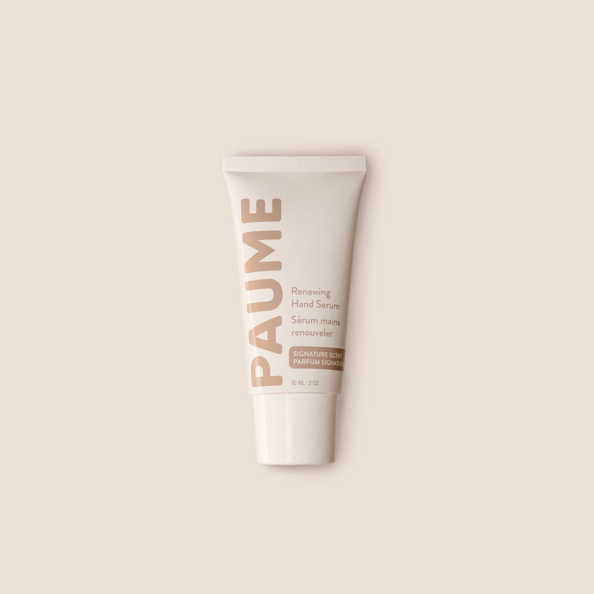 PAUME - RENEWING HAND SERUM by PAUME features beige and light brown text on a neutral background. This minimalist vitamin C serum targets hand hyperpigmentation and supports youthful-looking skin, with labels in English and French.