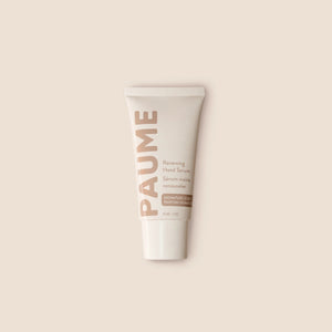 PAUME - RENEWING HAND SERUM by PAUME features beige and light brown text on a neutral background. This minimalist vitamin C serum targets hand hyperpigmentation and supports youthful-looking skin, with labels in English and French.