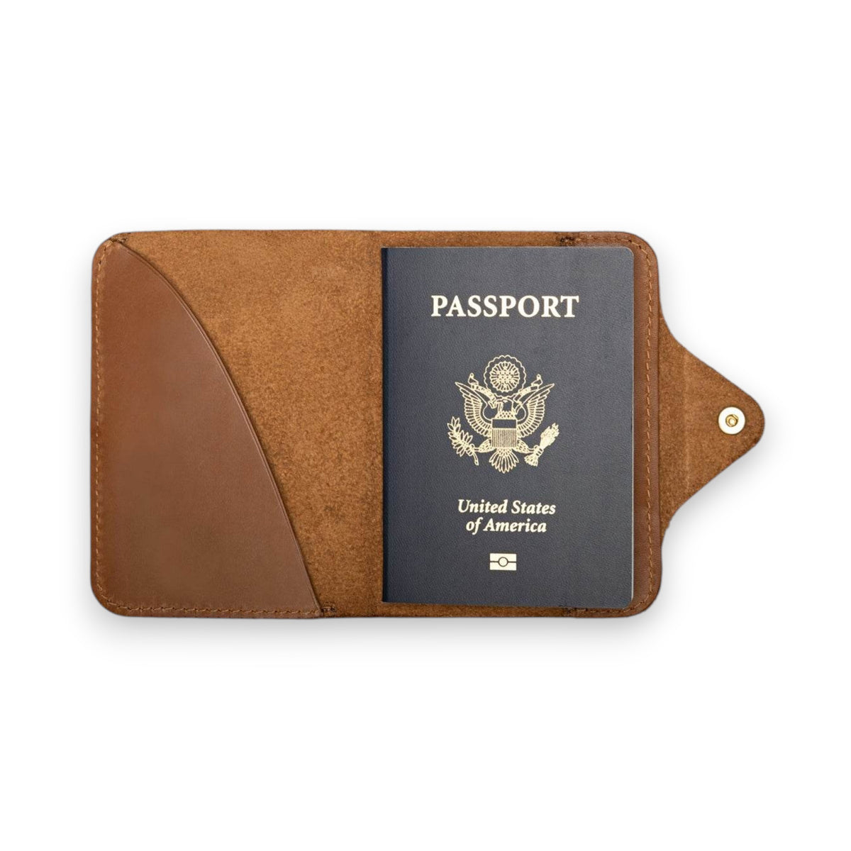 The WP STANDARD - PASSPORT WALLET by WP STANDARD is shown open on a white background with a U.S. passport on the right and an empty left pocket—a stylish full-grain leather travel essential.