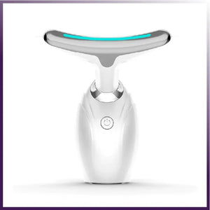 The ETERUS NECK AND FACE LIFTING LED THERAPY is a white massager with a T-shaped silver head, subtle blue accents, and a front power button. Designed for skincare routines, it features vibration massage for rejuvenation and is showcased against a plain white background.