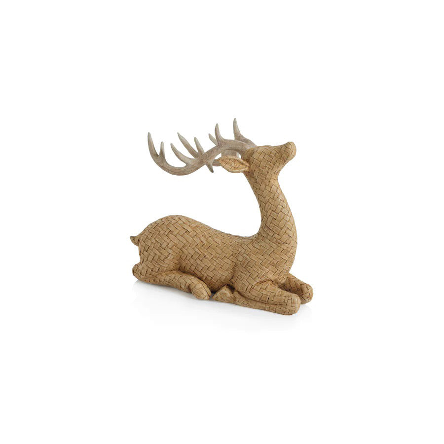 The ZODAX RATTAN SITTING DEER features two woven deer figurines—one standing, one lying down—with detailed antlers and 22.23 x 19.05 cm dimensions, displayed on a smooth gray surface against a neutral background.