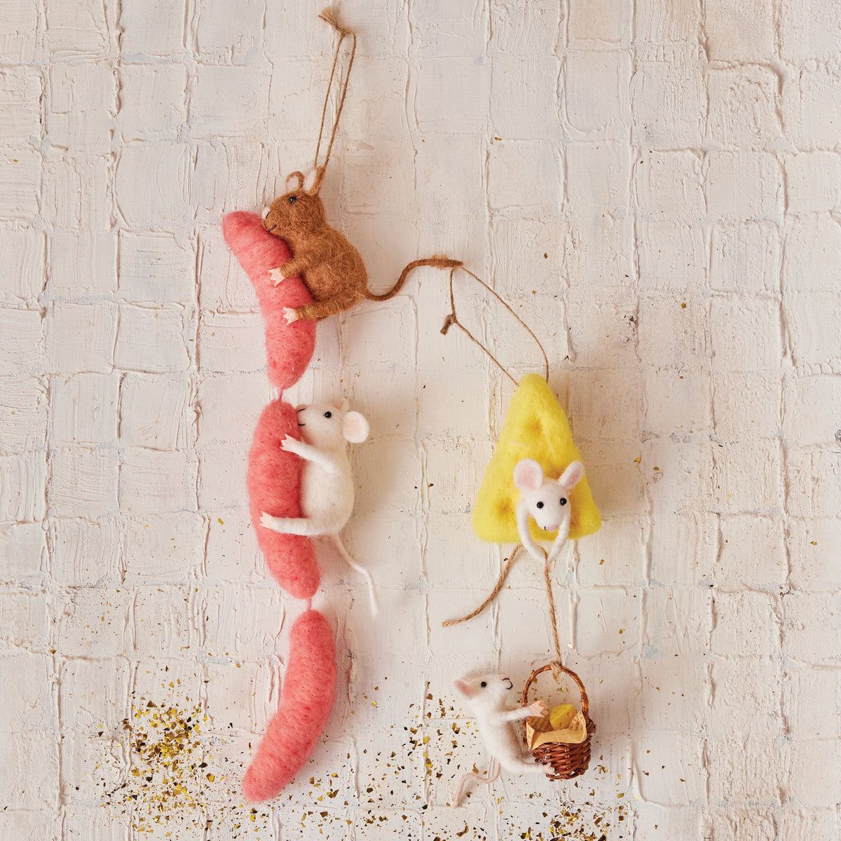 The CREATIVE COOP FELT MICE ON SAUSAGE AND CHEESE ORNAMENTS features four felt mice: two white on a pink sausage, a brown mouse above them, one on yellow cheese, and another lounging in a wicker basket.