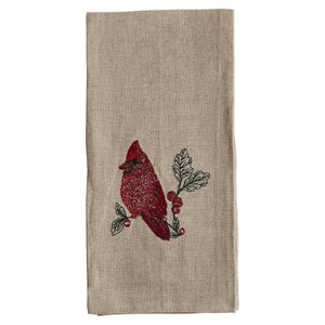 A RED CARDINAL LINEN TEA TOWEL by CORAL & TUSK made of beige natural flax fiber, embroidered with a red cardinal perched on a branch with berries and green leaves.