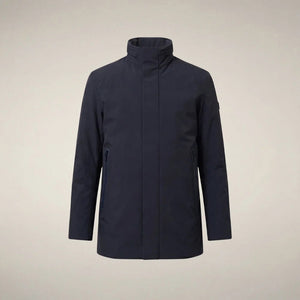 A man wears a dark blue SAVE THE DUCK - BLAISE JACKET IN BLUE BLACK with a high neck and a zippered chest pocket.