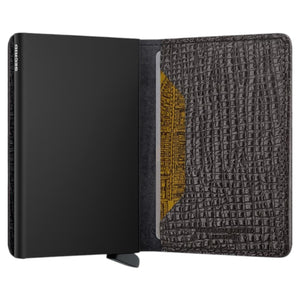 Illustration displaying the SECRID - Slimwallet Palmetto in Brown, expertly crafted by SECRID from refined Palmetto leather. The wallet measures 102 mm in height, 68 mm in width, 16 mm in thickness, and weighs 72 grams. Featuring RFID protection, the wallet is shown from both front and side perspectives.
