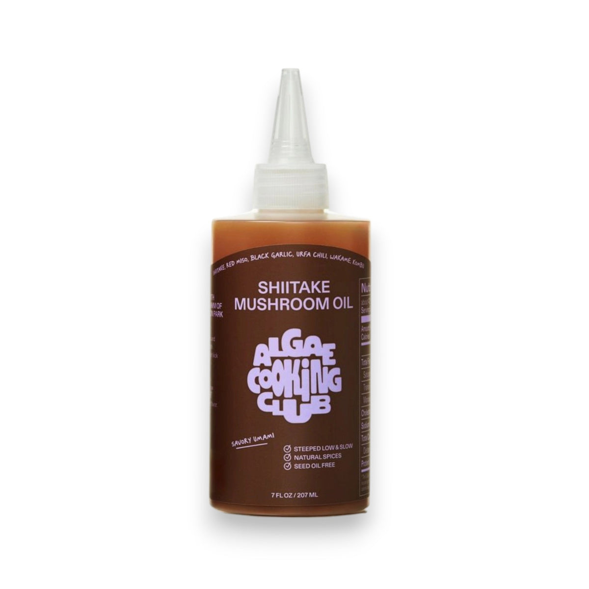 A bottle of ALGAE COOKING CLUB Shiitake Mushroom Oil with a pointed nozzle cap, brown and white label, described as a natural, savory Umami Finishing Oil that’s seed oil free.