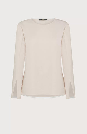 The SEVENTY Stretch Crewneck Viscose Top with Sleeve Detail is a light beige, long-sleeve shirt featuring a simple and elegant design. Made in Italy, this sophisticated top has slightly flared sleeves with subtle slits near the cuffs and a relaxed fit. Crafted from stretch viscose cady, it hangs straight for a minimalistic and refined appearance.
