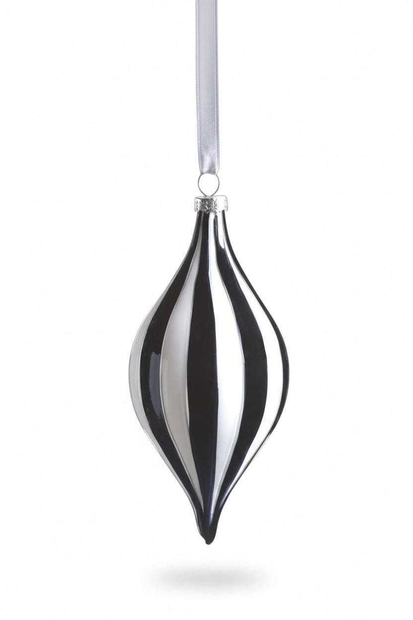 TWILIGHT STRIPE BLACK AND WHITE GLASS ORNAMENT, a teardrop-shaped glass ornament measuring 2.75 x 5.75 with alternating vertical black and white stripes, hanging from a white ribbon.