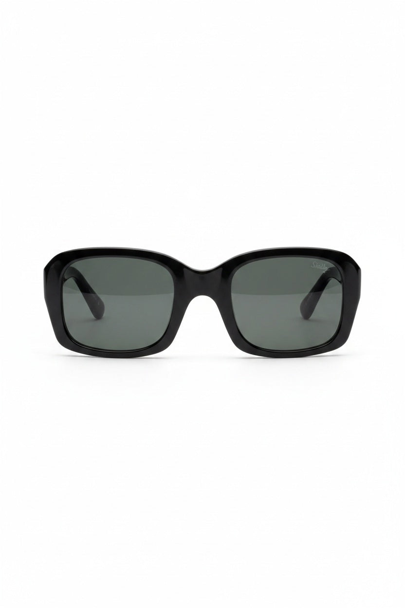 The CADDIS SHELPY Polarized Sunglasses feature a black, oversized square design with dark tinted lenses and a thick, glossy frame for a bold, modern look. Shown from the front on a white background.