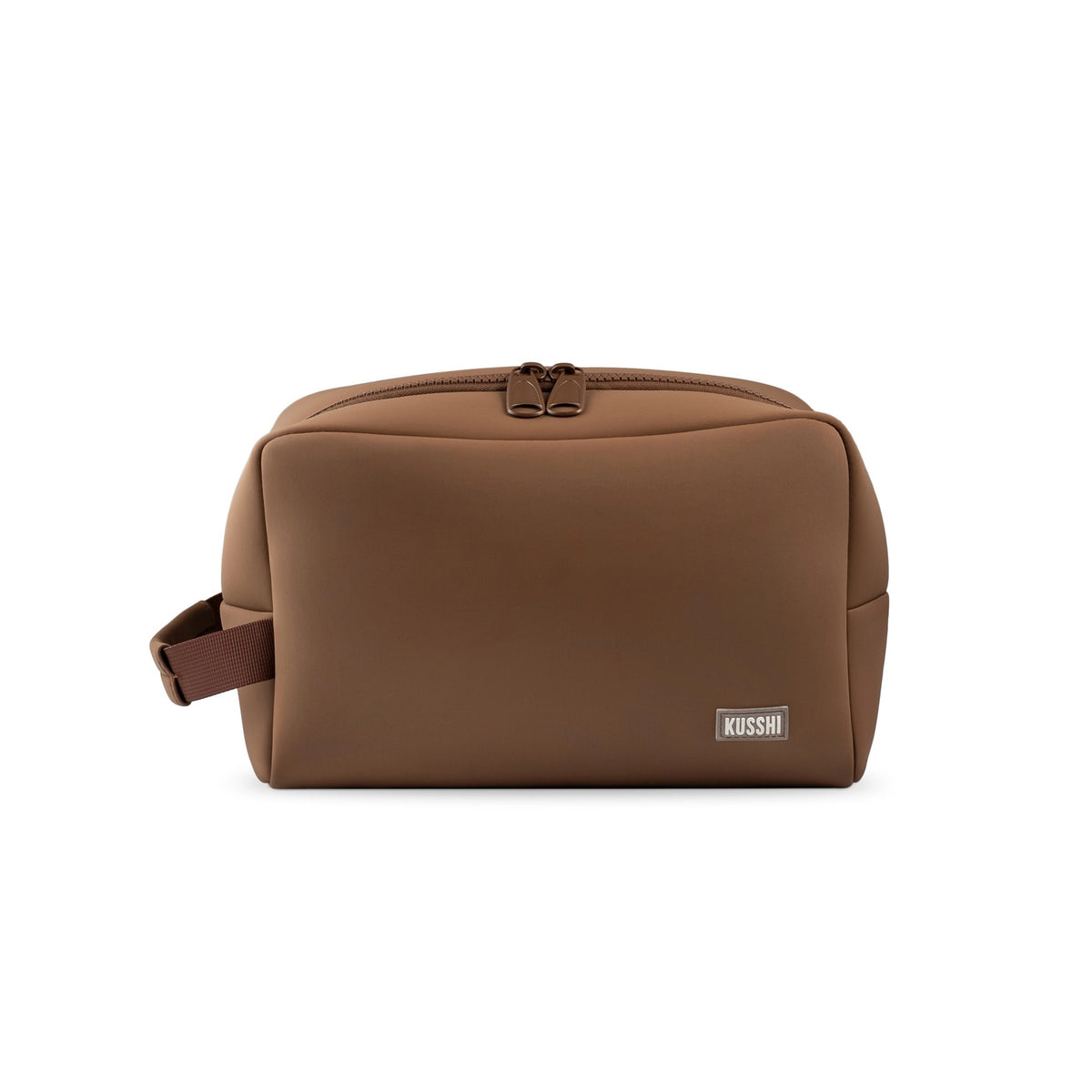 The KUSSHI Neoprene Dopp Kit in Chocolate is a stylish unisex toiletry bag with a blue zipper, perfect for organizing grooming essentials like razors, soap, combs, and lotions while you travel.