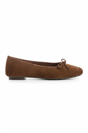 The REQINS HARMONY suede ballerina flats in Cacao, featuring delicate front bows, are shown against a plain light background.