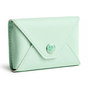 The E. FRANCES PAPER E. FRANNIE PACK, SEAGLASS is a mint green wallet with a snap closure, embossed with "E. FRANCES," ideal for holding Little Notes—perfect as a gift and shown against a white background.