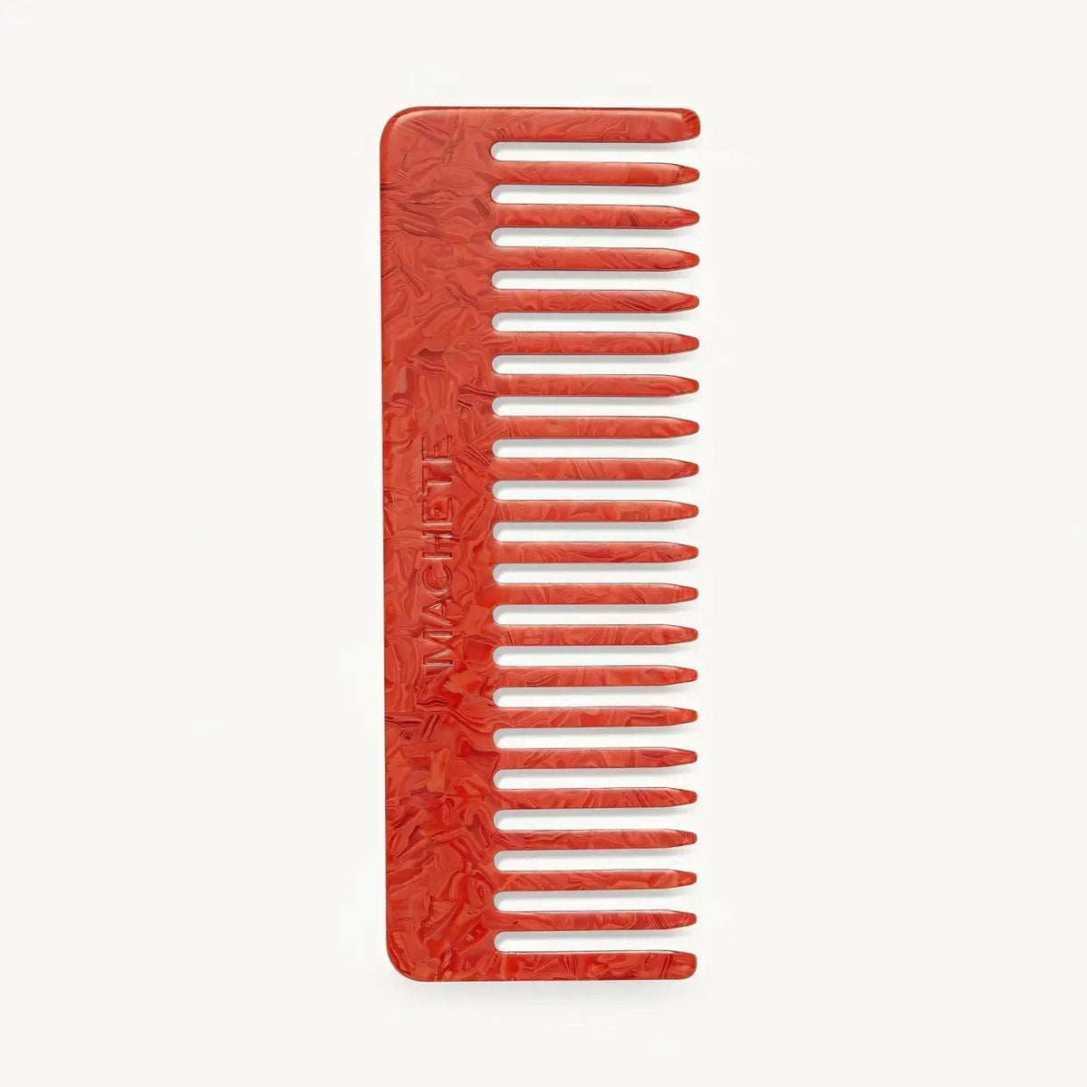 The MACHETE No. 2 Comb in Poppy is a red, marbled Italian acetate wide-tooth comb with a rectangular handle, shown against a plain white background.