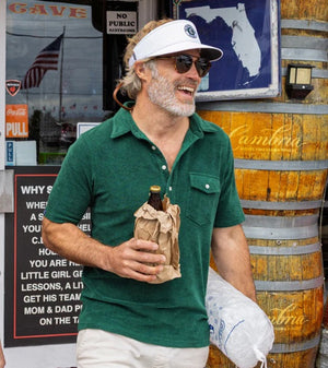 Close-up of the CRIQUET - Terrycloth Players Shirt in Alligator Alley, showing its green textured fabric, white buttons, chest pocket, and part of the classic fit collar.