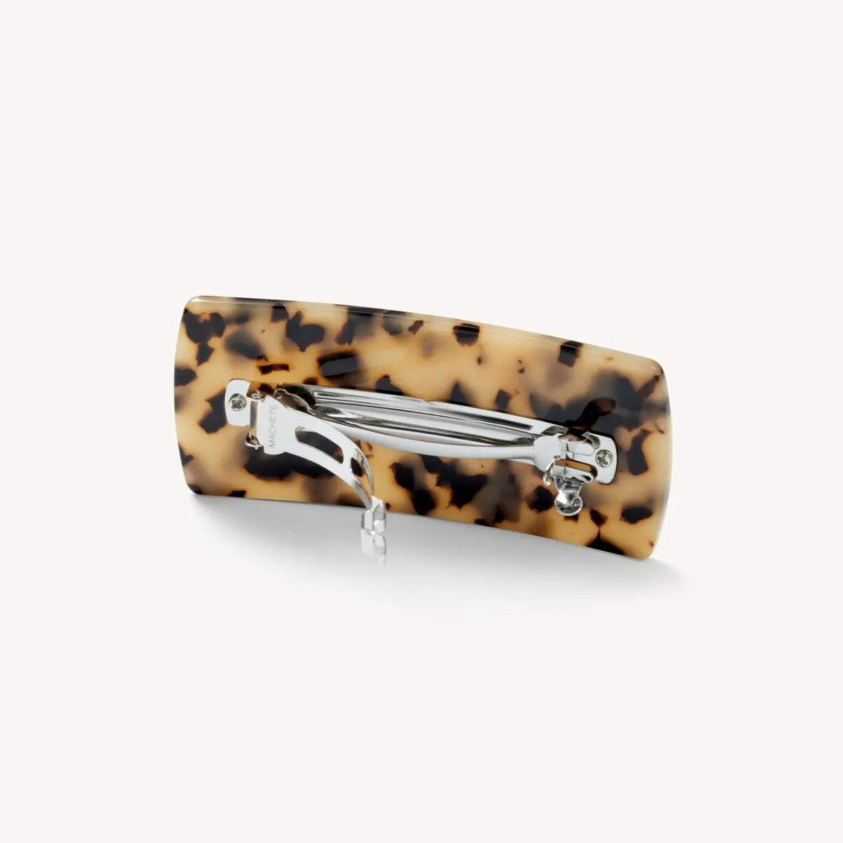 The MACHETE - Jumbo Box Barrette in Blonde Tortoise features a rectangular Italian acetate design with a beige and black tortoiseshell pattern, showcased against a plain white background.