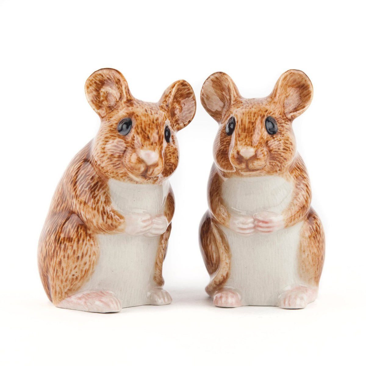 The QUAIL CERAMICS Wood Mouse Salt and Pepper Set by QUAIL DESIGNS features two hand-painted brown and white stoneware mice figurines with large ears, black eyes, and tiny paws, standing upright side by side.