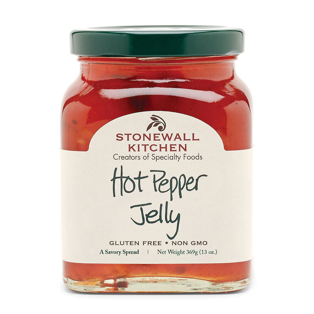A jar of STONEWALL KITCHEN - HOT PEPPER JELLY is displayed with a red and green label. The label features the text "Stonewall Kitchen, Creators of Specialty Foods" and "Hot Pepper Jelly." This spicy pepper jam is gluten-free, non-GMO, and weighs 13 ounces (369 grams).