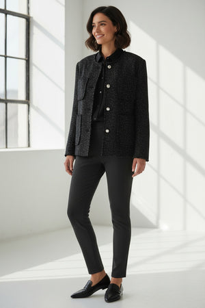 The ELEH - TWEED JACKET by ELEH features a dark, textured tweed design with four front pockets and silver buttons, reflecting modern sophistication and Italian tailoring against a plain white background.