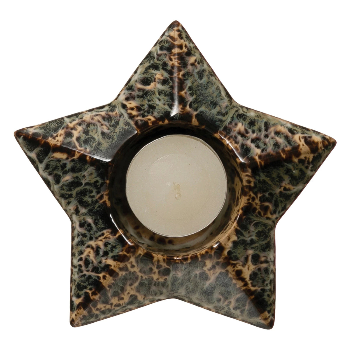 A minimalist winter scene featuring the CREATIVE COOP STONEWARE STAR TEALIGHT HOLDER, stoneware and ceramic pine trees, wooden log vases with pine branches, a fluffy white owl figurine, all arranged on a light wooden table against a plain white wall.