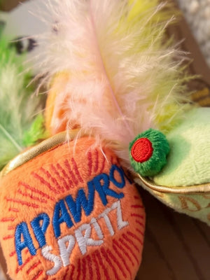Delight and entertain your feline friend with the KITTY COCKTAILS ORGANIC CATNIP TOYS by HAUTE DIGGITY DOG—this playful set features two plush cat toys shaped like cocktails: one orange with a green feather, labeled "Apawrol Spritz," and one pale green with a yellow feather, labeled "Dirty Catini." Both toys have white stems, gold accents, and are crafted from organic catnip for irresistible feline fun.