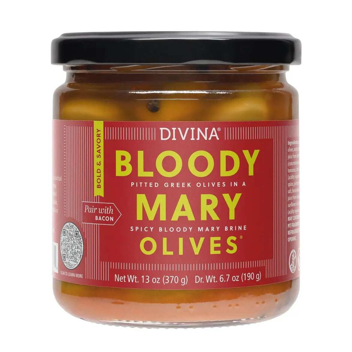 A Bloody Mary cocktail garnished with celery and DIVINA - BLOODY MARY OLIVES sits next to a jar of DIVINA - BLOODY MARY OLIVES and a small bowl of green olives on a white countertop with a tiled background, highlighting the perfect cocktail garnish enhanced by flavorful Bloody Mary brine from DIVINA.