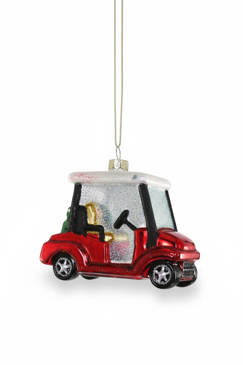 A glittery, 3.75-inch red and white GLASS GOLF CART ORNAMENT by CODY FOSTER.