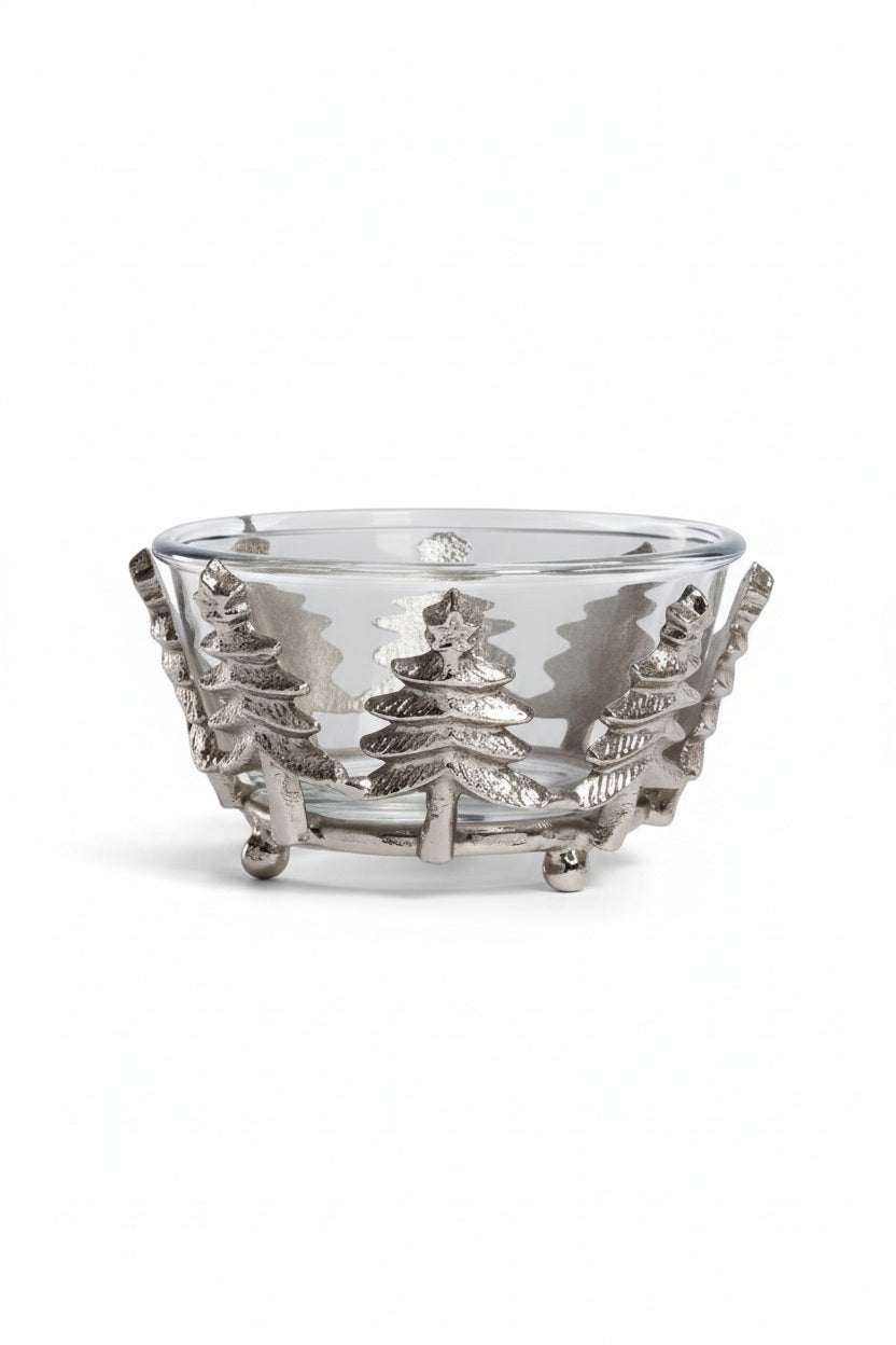 ZODAX GLASS AND ALLOR BOWL: a 5.5 in x 3 in clear glass bowl set in a silver-toned aluminum base featuring a decorative row of evergreen trees.