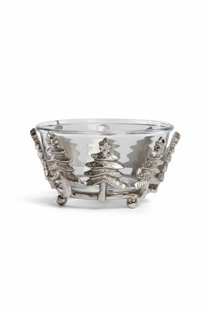 ZODAX GLASS AND ALLOR BOWL: a 5.5 in x 3 in clear glass bowl set in a silver-toned aluminum base featuring a decorative row of evergreen trees.