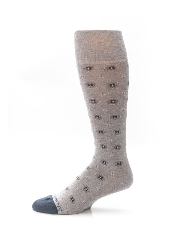 A single EDWARD ARMAH EDWARD ARMRAH - GREY NAVY FOULARD SOCK, featuring small dark blue dots and a navy toe, is displayed upright against a white background.