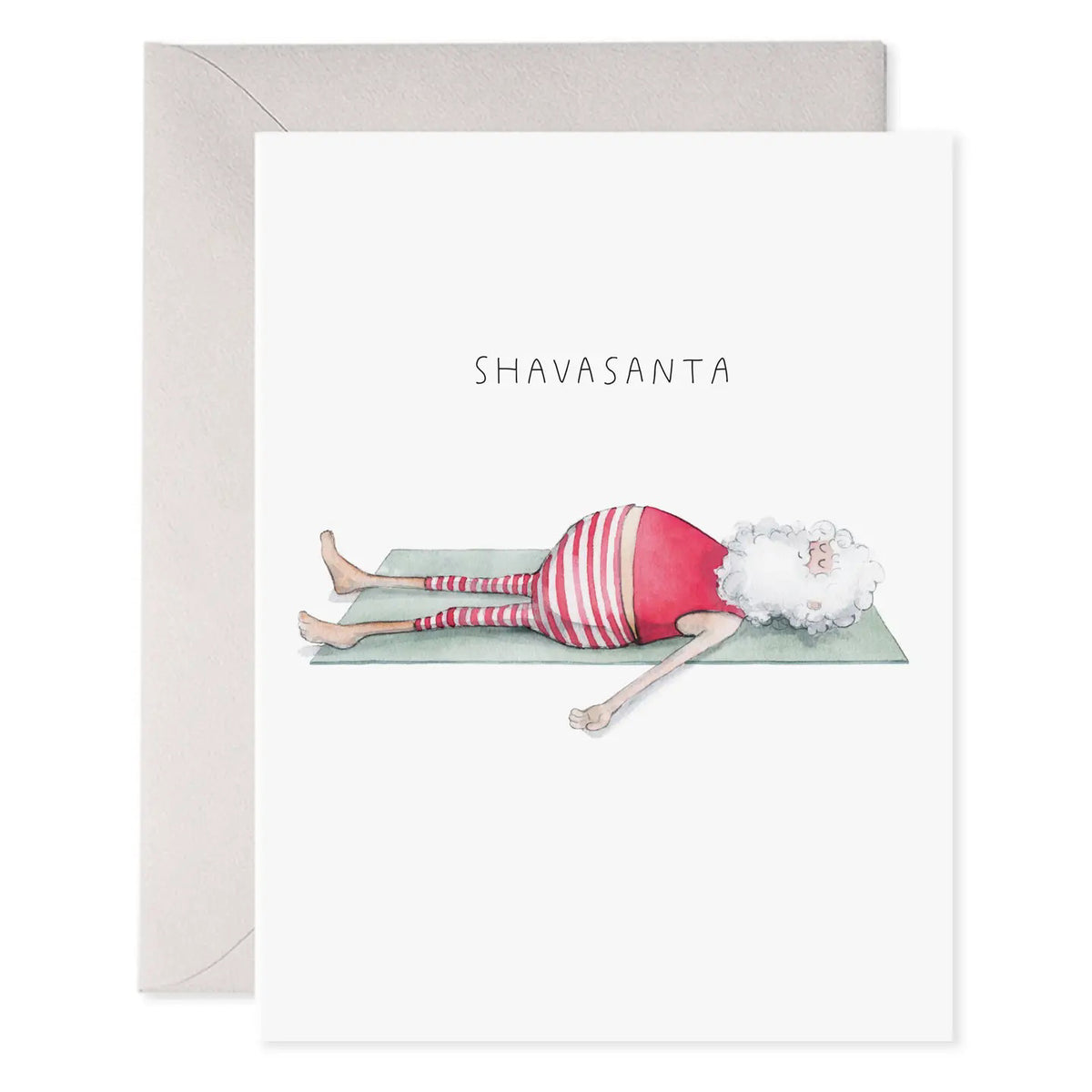 The E. FRANCES - YOGA SANTA GREETING CARD by E. FRANCES PAPER shows Santa in striped pajamas doing shavasana on a yoga mat, with &quot;SHAVASANTA&quot; above him. Proudly made in the USA.
