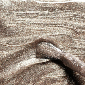 Discover nine vegan nail polish swatches from MANUCURIST INC, including the GREEN™ NAIL POLISH IN METALLIC, along with shades like Mermaid, Nebula, Disco, Moon, Diamant, Quartz, Fairy, Tweed, and Pearlescent. Each features shimmery or pearly finishes in a range of vibrant colors. These non-toxic polishes include striking iridescent gold effects for a glamorous manicure.
