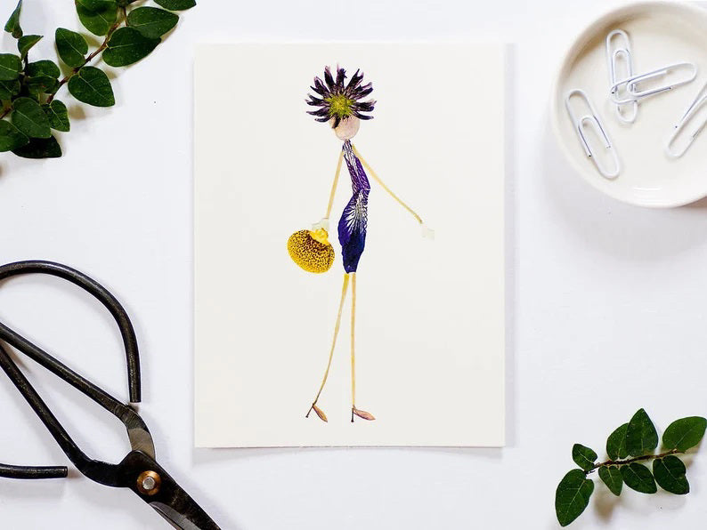 The PETAL PEOPLE PRESS - CHIC CARD showcases a whimsical fashionista made from flower petals and plant materials, featuring a stylized dress, shoes, handbag, and spiky hairstyle. This charming floral art stands upright on a white background, ideal for a botanical note card.