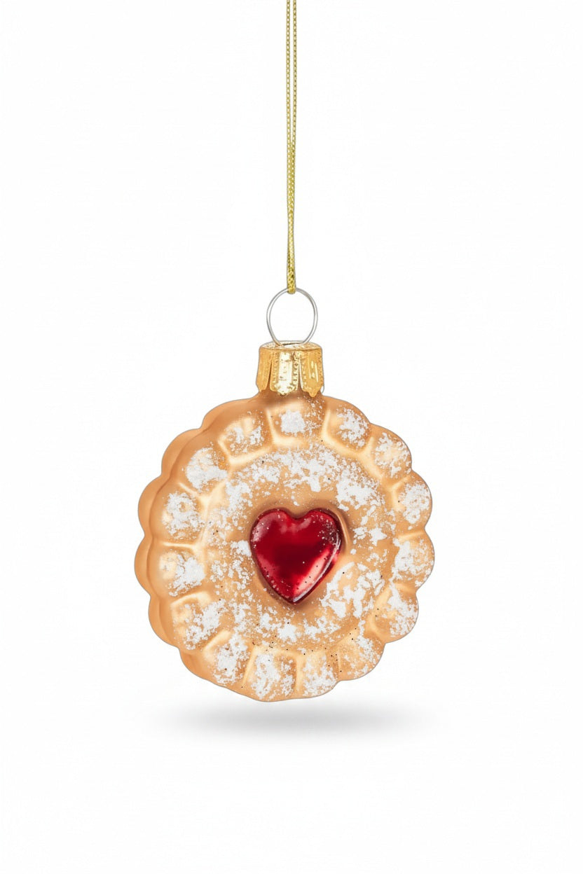 ABBOTT ICED COOKIE ORNAMENT: a round scalloped holiday cookie with a red heart-shaped center and a dusting of white sugar.