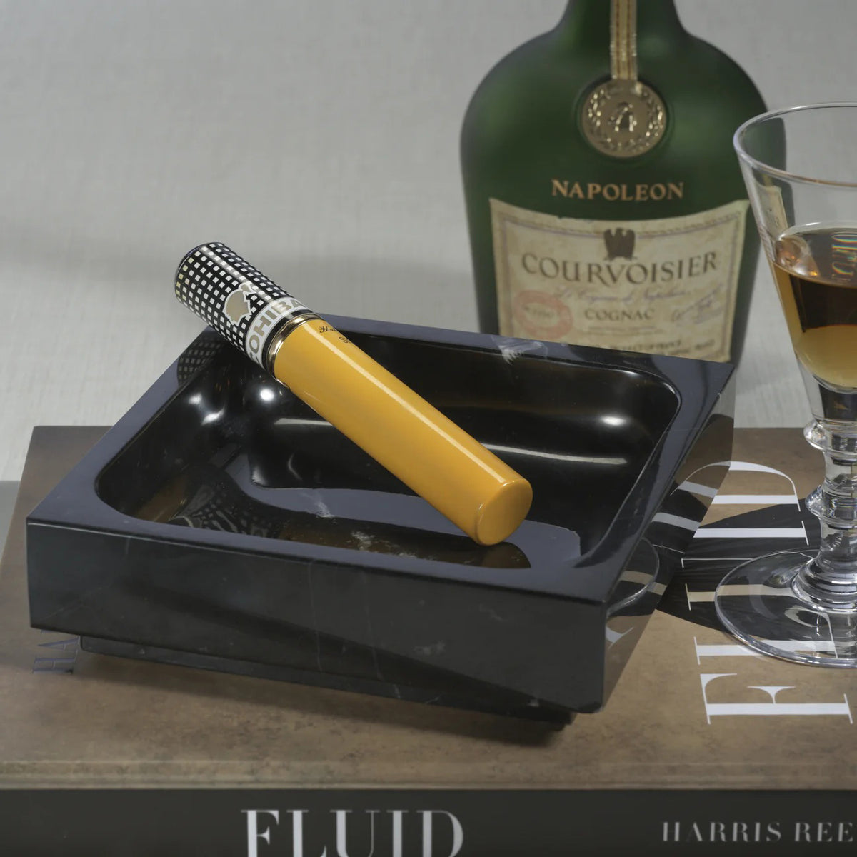 The ZODAX NERO MARQUINA NATURAL MARBLE TRAY - SMALL features a square shape, black marble with a smooth, glossy finish and rounded inner corners, highlighting its high-quality material and minimalist design against a plain white background.