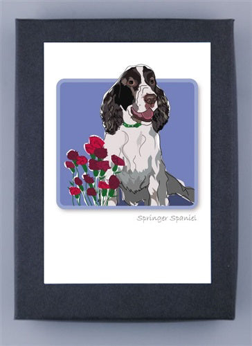 The PAPER RUSSELLS - SPRINGER SPANIEL WITH FLOWERS NOTECARDS features an illustration of a Springer Spaniel wearing a green collar amid red flowers on a blue background, with "Springer Spaniel" inscribed. It's printed on premium recycled paper and framed in white with a dark border.