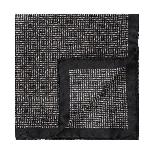 The AMANDA CHRISTENSEN - Silk Pocket Square with Micro Pattern Twill in Black, crafted from fine silk, displays a subtle micro-pattern for a sophisticated touch—an indispensable accessory for the discerning gentleman.