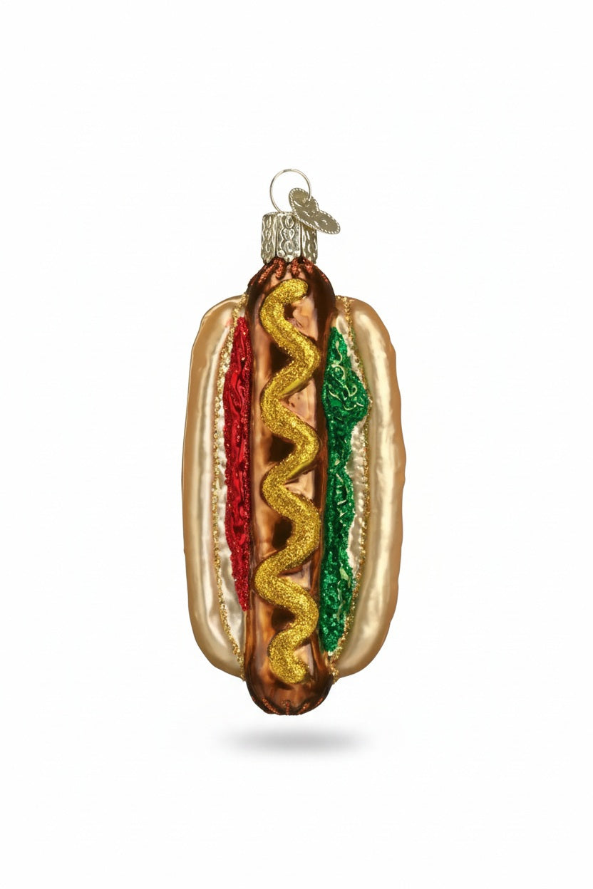 Old World Christmas HOT DOG ORNAMENT shaped like a hot dog with a yellow mustard swirl, red ketchup, and green relish.