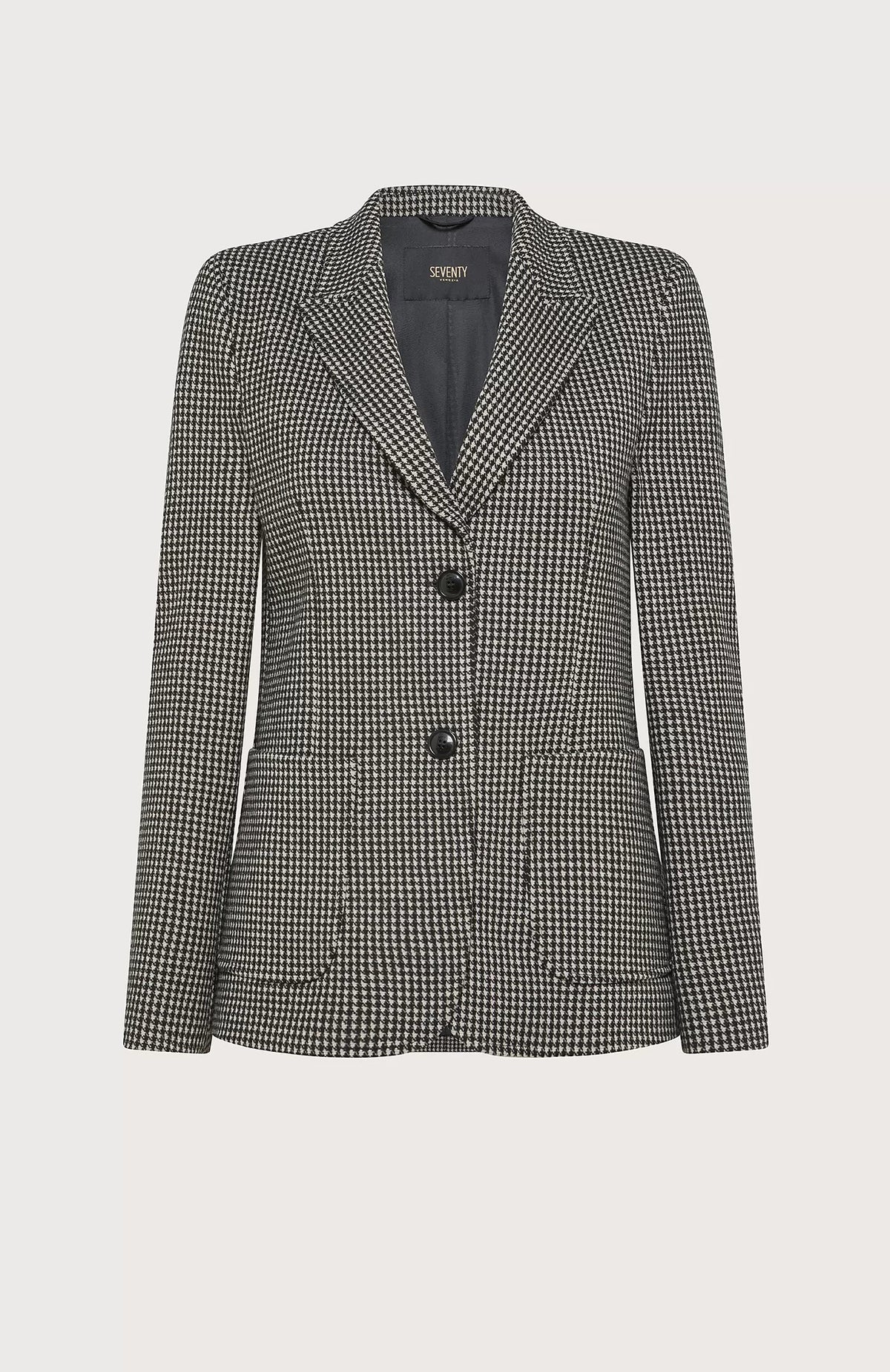 The SEVENTY Stretch Jacquard Vichy Jacket by SEVENTY is a tailored women&#39;s blazer featuring a classic black and white houndstooth pattern. Made in Italy, it boasts a notched lapel, two large black buttons for closure, and front flap pockets. The inner lining is dark grey, complementing its overall structured design.