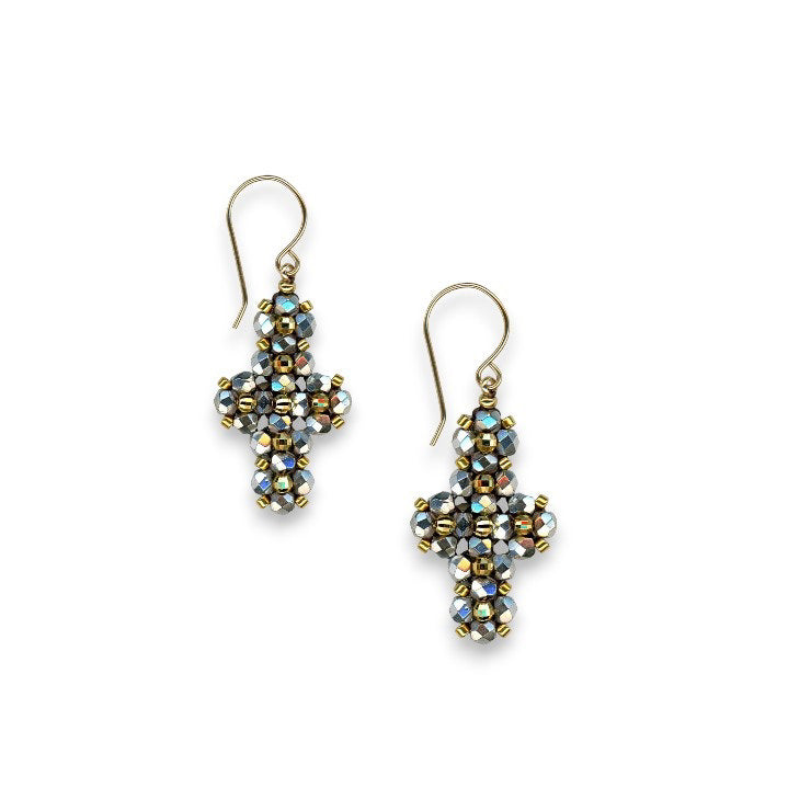 Part of the MIGUEL ASES – PYRITE MIYUKI CROSS EARRINGS from MIGUEL ASES, INC., these cross-shaped earrings are handcrafted with multifaceted beads in shades of blue, silver, and gold. Featuring hook-style clasps, they are elegantly displayed side by side on a plain white background.
