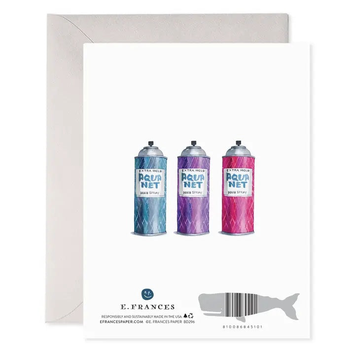 The E. Frances AquaNet Birthday Card by E. Frances Paper showcases a watercolor illustration of a blue Aqua Net hairspray can with the caption: "Remember when we ruined the ozone together. Happy Birthday." Printed on heavyweight paper, the card is pictured with a partially visible envelope behind it.