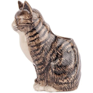 The QUAIL CERAMICS - MILLIE CAT BUD VASE by QUAIL DESIGNS is a ceramic vase shaped like a gray tabby cat, with flowers displayed as if sprouting from its head—an adorable gift for cat lovers.