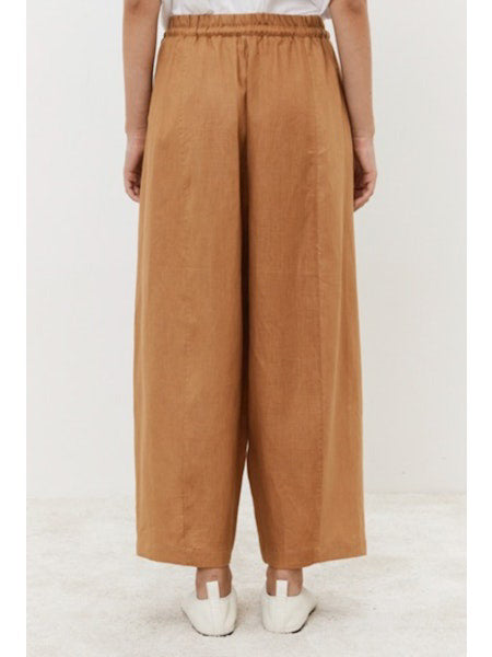 Close-up of dark fabric texture, showcasing a uniform, slightly rough surface with visible weave—ideal for crafting MEIMEIJ&#39;s Linen Drawstring Pant by MEIMEIJ, offering an adjustable fit and wide-leg silhouette.