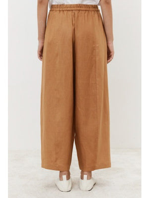 Close-up of dark fabric texture, showcasing a uniform, slightly rough surface with visible weave—ideal for crafting MEIMEIJ's Linen Drawstring Pant by MEIMEIJ, offering an adjustable fit and wide-leg silhouette.