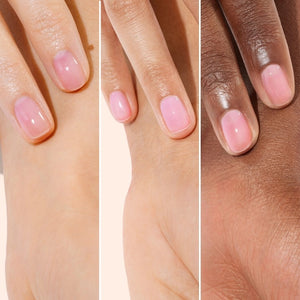 A pink serum drop labeled with its ingredients: raspberry extract (strengthens nails), AHAs (restore and harden), and sweet almond oil (nourishes). The text highlights that MANUCURIST - ACTIVE GLOW CARE POLISH by MANUCURIST INC is 85.5% plant-based—making it the ideal nail strengthener for achieving healthy, glass-like nails.